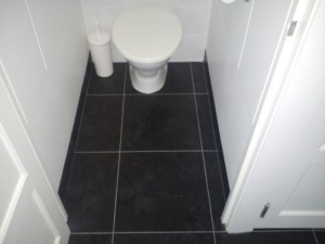 Here we have fitted vinyl tiles fully adhered with feature strip to complete.