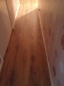 Here we have laid 8mm Tarditional Oak in a Hallway with matching Scotia to perimeters.